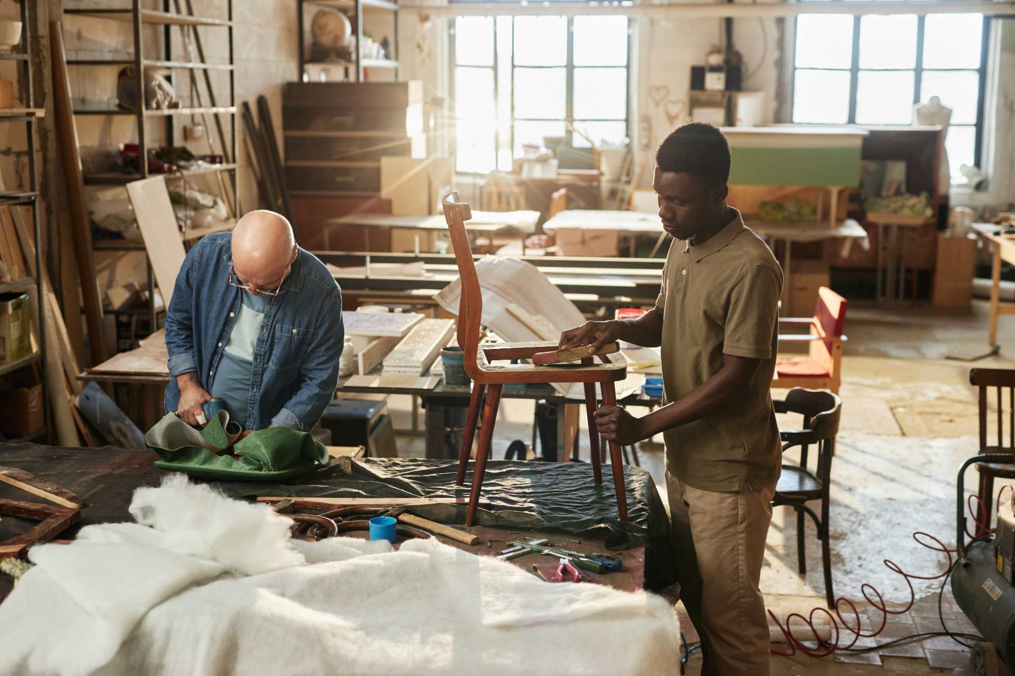two-people-working-on-furniture-restoration-in-wor-2025-03-05-17-20-23-utc.jpg